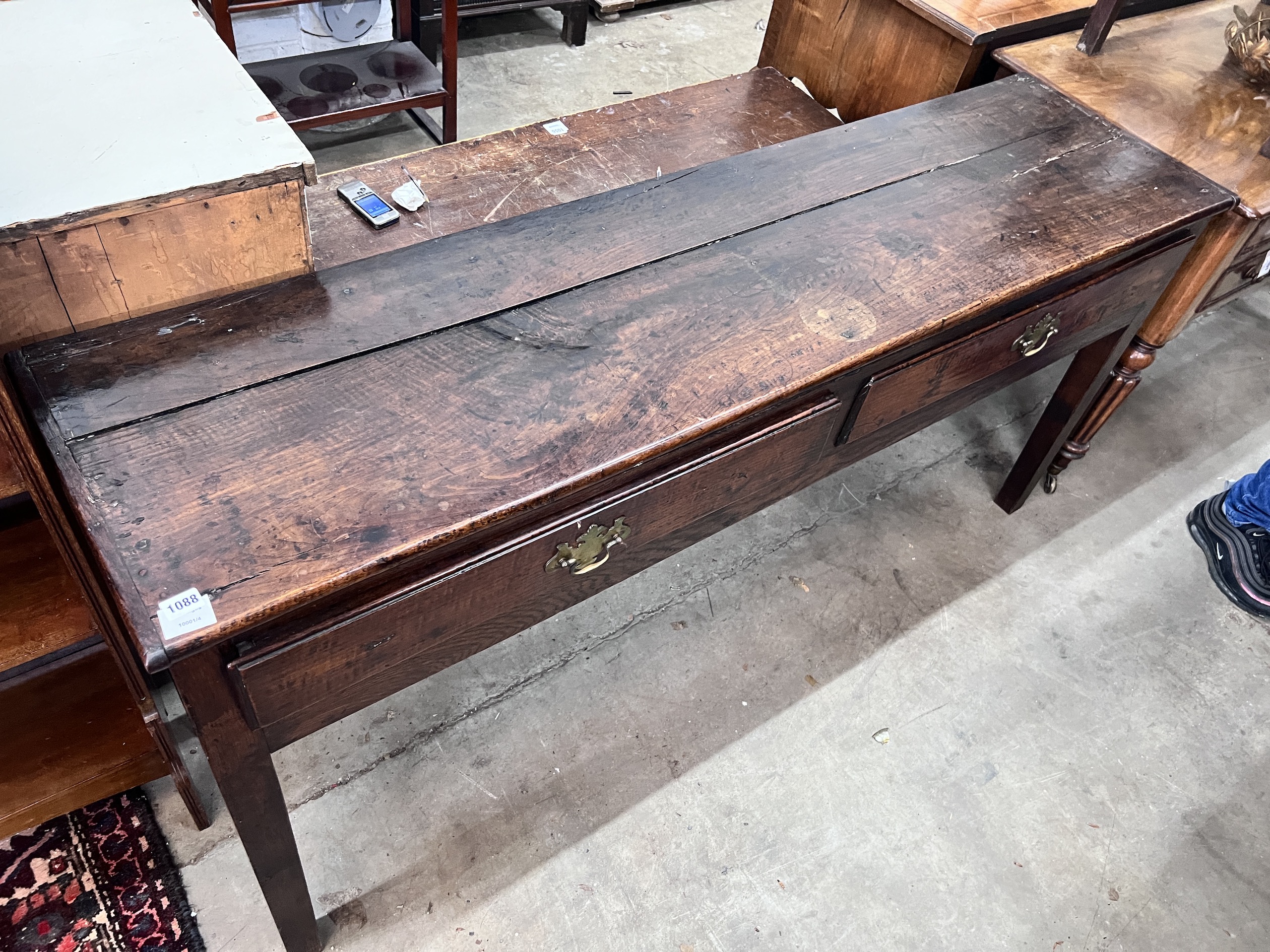 An 18th century oak low dresser, fitted two drawers, width 168cm, depth 45cm, height 78cm